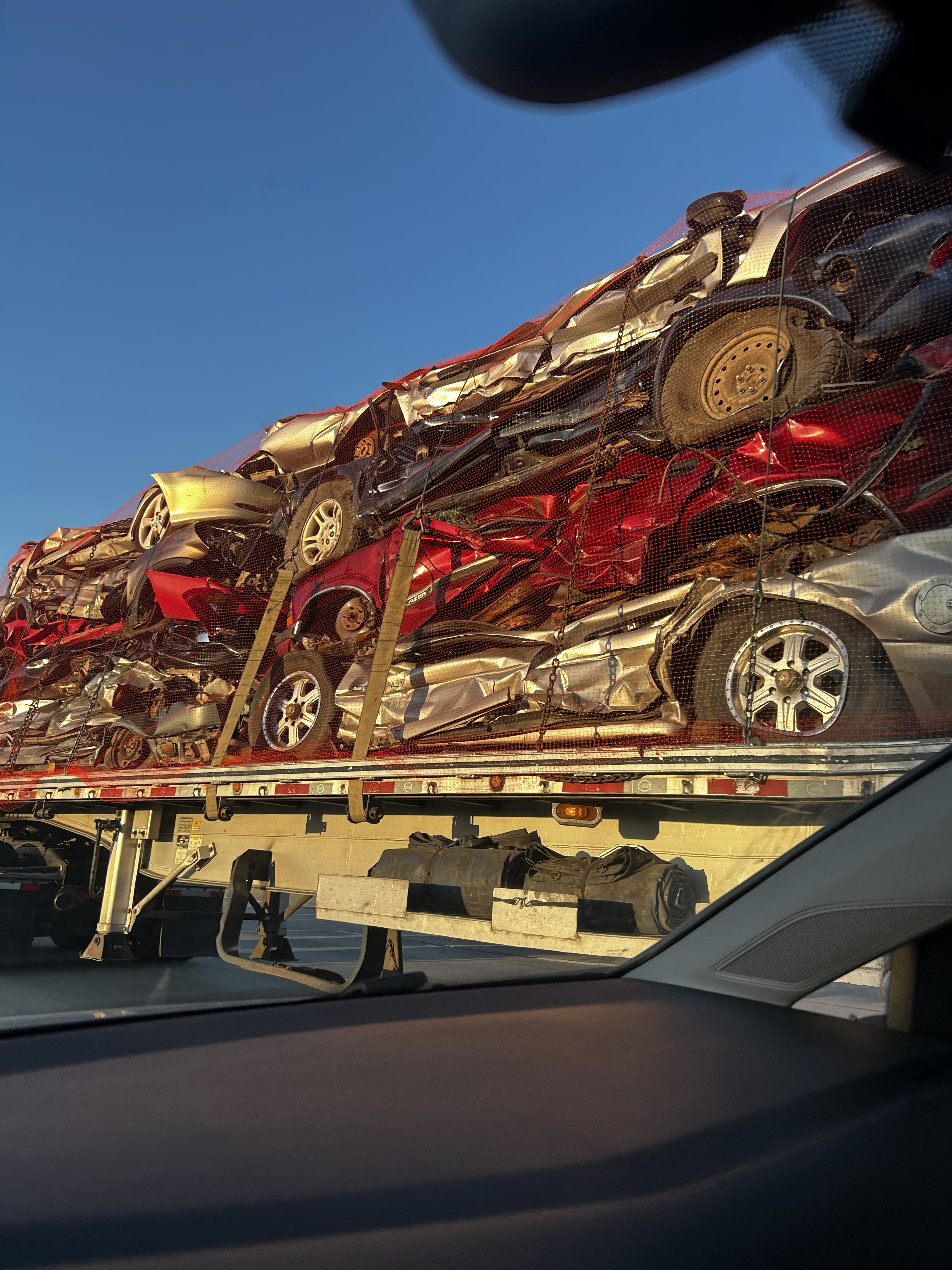 compacter cars on a semi trailer